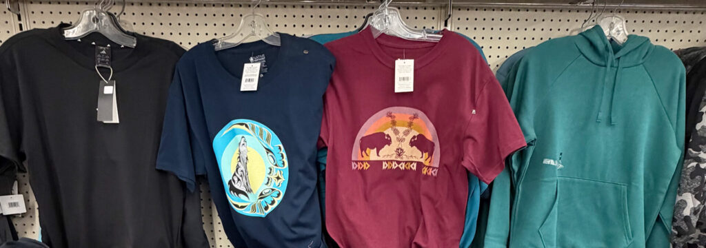 coloured t-shirts, black, blue with artwork, red with artwork, green hoodie