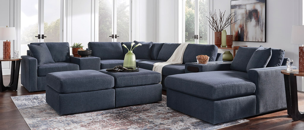 Blue Modmax sectional in a living room with area rug on the floor